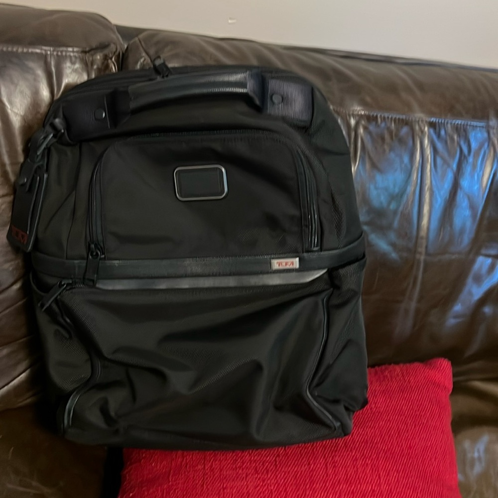 Tumi backpack barely used
